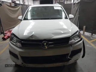 2012 Volkswagen Touareg Sport with VIN WVGFK9BP2CD002991, listed as a IAAI auction lot 42077523 with 94,515 mi miles and . Bid and sale history available at DreamBid. Image 12.