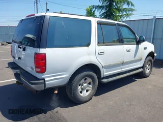 1997 Ford Expedition XLT z VIN 1FMFU18L3VLA65297, wystawiony jako IAAI lot #42418325 z przebiegiem 266 297 mil mil oraz . Historia ofert i sprzedaży dostępna na DreamBid. Obrazek 4.