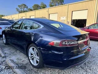 2013 Tesla Model S with VIN 5YJSA1DN8DFP17027, listed as a IAAI auction lot 42168317 with 148,394 mi miles. Bid and sale history available at carsss.com. Image 3.