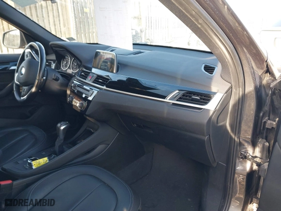 2018 BMW X1 xDrive28i with VIN WBXHT3C33J5F90349, listed as a IAAI auction lot 41385063 with 55,994 mi miles. Bid and sale history available at carsss.com. Image 5.