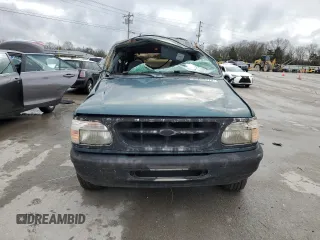 1996 Ford Explorer XL с VIN 1FMDU34X9TUC66723, выставлен на аукционе Copart как лот 86659774 с пробегом 190 164 миль миль и Списание • Salvage title. История ставок и продаж доступна на DreamBid. Изображение 5.