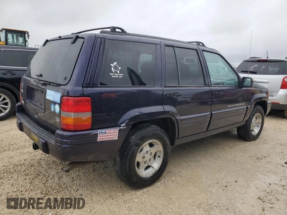 1998 Jeep Grand Cherokee with VIN 1J4FX48S1WC244308, listed as a Copart auction lot 74384714 with Not provided miles and Non repairable. Bid and sale history available at DreamBid. Image 3.