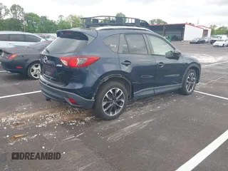 2016 Mazda CX-5 Grand Touring with VIN JM3KE2DYXG0890174, listed as a IAAI auction lot 42157884 with 141,873 mi miles. Bid and sale history available at carsss.com. Image 4.