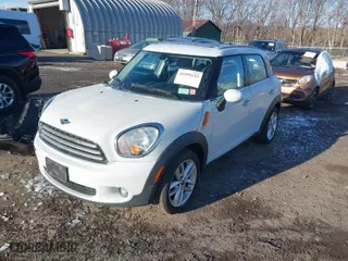 2014 MINI Cooper Countryman with VIN WMWZB3C58EWM32024, listed as a IAAI auction lot 41594143 with NaN miles. Bid and sale history available at carsss.com. Image 2.