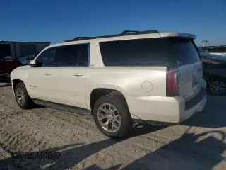 2015 GMC Yukon XL SLT with VIN 1GKS1HKC6FR166415, listed as a Copart auction lot 73029014 with 105,209 mi miles and Salvage Title. Bid and sale history available at carsss.com. Image 2.