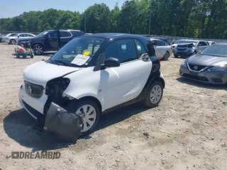 2016 Smart fortwo Passion z VIN WMEFJ5DA6GK078340, wystawiony jako IAAI lot #42140363 z przebiegiem 114 647 mil mil oraz . Historia ofert i sprzedaży dostępna na DreamBid. Obrazek 18.