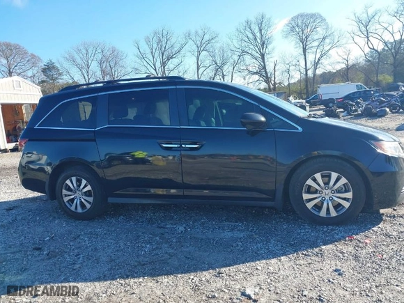 2016 Honda Odyssey EX-L with VIN 5FNRL5H63GB050617, listed as a IAAI auction lot 41678167 with 128,000 mi miles. Bid and sale history available at carsss.com. Image 13.