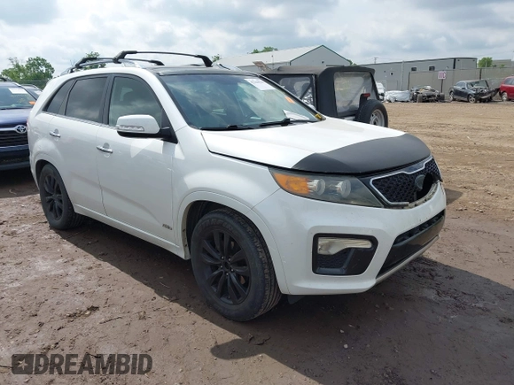 2012 Kia Sorento SX z VIN 5XYKWDA23CG231228, wystawiony jako IAAI lot #42366536 z przebiegiem 154 627 mil mil oraz . Historia ofert i sprzedaży dostępna na DreamBid. Obrazek 1.