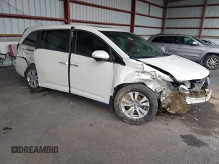 2014 Honda Odyssey EX-L with VIN 5FNRL5H63EB056317, listed as a IAAI auction lot 42020371 with 113,144 mi miles and . Bid and sale history available at DreamBid. Image 1.