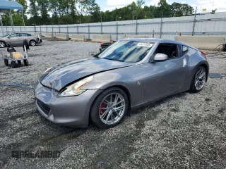 2009 Nissan 370Z z VIN JN1AZ44E69M409779, wystawiony jako Copart lot #55615955 z przebiegiem 132 674 mil mil oraz Szkoda całkowita • Salvage title. Historia ofert i sprzedaży dostępna na DreamBid. Obrazek 1.