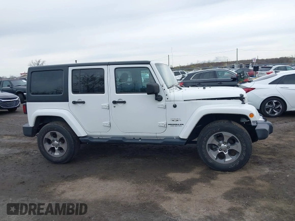 2017 Jeep Wrangler Unlimited Sahara z VIN 1C4BJWEG2HL695672, wystawiony jako IAAI lot #42008396 z przebiegiem 56 028 mil mil oraz . Historia ofert i sprzedaży dostępna na DreamBid. Obrazek 13.