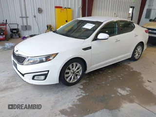 2015 Kia Optima LX with VIN KNAGM4A79F5616665, listed as a IAAI auction lot 42121526 with 153,022 mi miles. Bid and sale history available at carsss.com. Image 2.