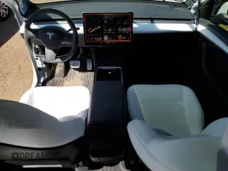 2024 Tesla Model Y Performance with VIN 7SAYGDEF6RA284171, listed as a Copart auction lot 50317205 with 6,870 mi miles and Salvage Title. Bid and sale history available at DreamBid. Image 8.