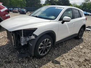 2016 Mazda CX-5 Grand Touring z VIN JM3KE4DY4G0868750, wystawiony jako Copart lot #56678905 z przebiegiem 145 712 mil mil oraz Szkoda całkowita • Salvage title. Historia ofert i sprzedaży dostępna na DreamBid. Obrazek 1.