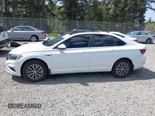 2019 Volkswagen Jetta SEL z VIN 3VWE57BU1KM111170, wystawiony jako IAAI lot #42179819 z przebiegiem 92 300 mil mil oraz . Historia ofert i sprzedaży dostępna na DreamBid. Obrazek 14.