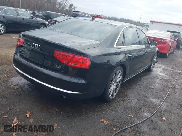 2012 Audi A8 L with VIN WAURVAFD8CN006917, listed as a IAAI auction lot 40877090 with 144,387 mi miles. Bid and sale history available at carsss.com. Image 4.