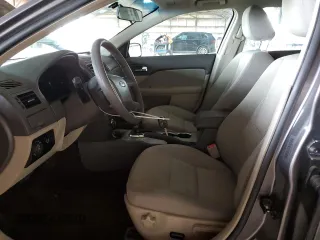 2010 Ford Fusion SE with VIN 3FAHP0HA2AR320858, listed as a Copart auction lot 52054045 with 151,943 mi miles and Salvage Title. Bid and sale history available at DreamBid. Image 7.