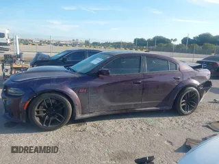 2021 Dodge Charger Scat Pack Widebody with VIN 2C3CDXGJXMH559036, listed as a IAAI auction lot 41895328 with 55,017 mi miles and . Bid and sale history available at DreamBid. Image 14.