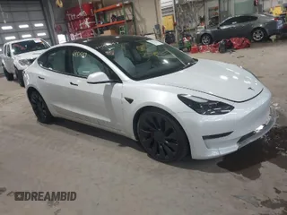 2023 Tesla Model 3 Performance with VIN 5YJ3E1EC3PF404882, listed as a IAAI auction lot 41551557 with 36,698 mi miles. Bid and sale history available at carsss.com. Image 1.