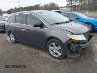 2012 Honda Odyssey Touring with VIN 5FNRL5H99CB071010, listed as a IAAI auction lot 41651233 with 186,913 mi miles. Bid and sale history available at carsss.com. Image 1.