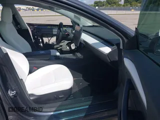2022 Tesla Model 3 Performance with VIN 5YJ3E1EC9NF201184, listed as a IAAI auction lot 41534959 with 29,389 mi miles and . Bid and sale history available at DreamBid. Image 5.