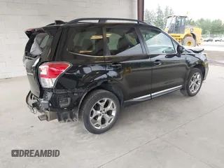 2018 Subaru Forester Touring with VIN JF2SJAWC2JH598982, listed as a IAAI auction lot 42455652 with 57,254 mi miles and . Bid and sale history available at DreamBid. Image 4.