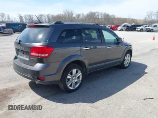 2014 Dodge Journey Limited with VIN 3C4PDDDG7ET138601, listed as a IAAI auction lot 42021766 with 214,220 mi miles and . Bid and sale history available at carsss.com. Image 4.