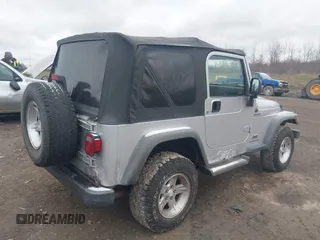 2004 Jeep Wrangler Sport with VIN 1J4FA49S64P749380, listed as a IAAI auction lot 41935405 with 84,690 mi miles. Bid and sale history available at carsss.com. Image 4.