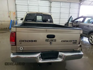 2003 Dodge Dakota SLT z VIN 1D7HL42N63S132141, wystawiony jako Copart lot #56138235 z przebiegiem 219 246 mil mil oraz Szkoda całkowita • Salvage title. Historia ofert i sprzedaży dostępna na DreamBid. Obrazek 6.