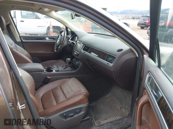 2013 Volkswagen Touareg Lux with VIN WVGEF9BP1DD012851, listed as a IAAI auction lot 41732391 with 123,283 mi miles and . Bid and sale history available at DreamBid. Image 5.