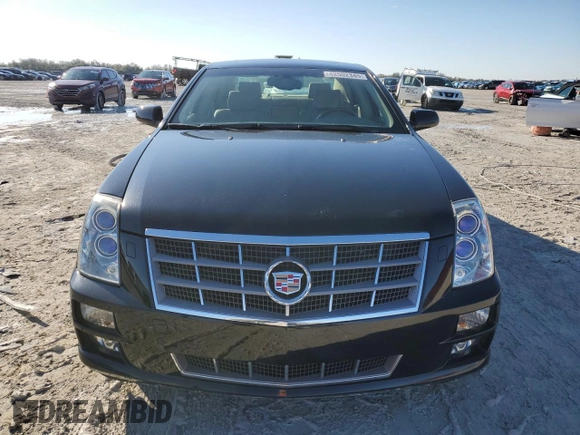 2009 Cadillac STS AWD z VIN 1G6DD67V690120833, wystawiony jako Copart lot #42502345 z przebiegiem 100 250 mil mil oraz Szkoda całkowita • Salvage title. Historia ofert i sprzedaży dostępna na DreamBid. Obrazek 5.