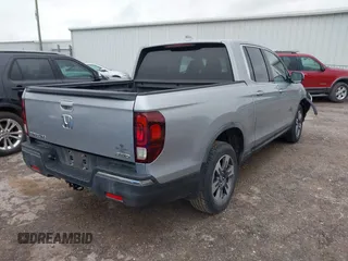 2018 Honda Ridgeline RTL with VIN 5FPYK3F52JB002649, listed as a IAAI auction lot 42338360 with 68,802 mi miles and . Bid and sale history available at DreamBid. Image 4.