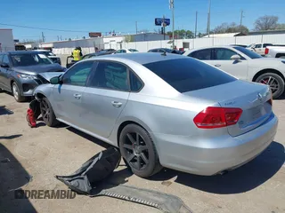 2015 Volkswagen Passat 1.8T Limited Edition with VIN 1VWAT7A30FC014689, listed as a IAAI auction lot 41758748 with 140,545 mi miles. Bid and sale history available at carsss.com. Image 3.