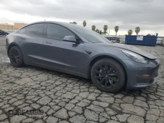 2022 Tesla Model 3 Long Range with VIN 5YJ3E1EB9NF117339, listed as a Copart auction lot 55659415 with 87,479 mi miles and Salvage Title. Bid and sale history available at DreamBid. Image 4.