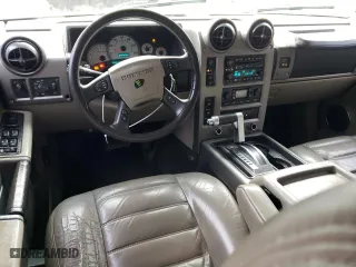 2003 Hummer H2 with VIN 5GRGN23U73H111109, listed as a Copart auction lot 76388144 with 160,179 mi miles and Salvage Title. Bid and sale history available at carsss.com. Image 8.