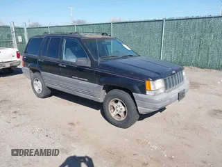 1997 Jeep Grand Cherokee Laredo with VIN 1J4GZ58S4VC633205, listed as a IAAI auction lot 41727571 with 201,228 mi miles. Bid and sale history available at carsss.com. Image 1.