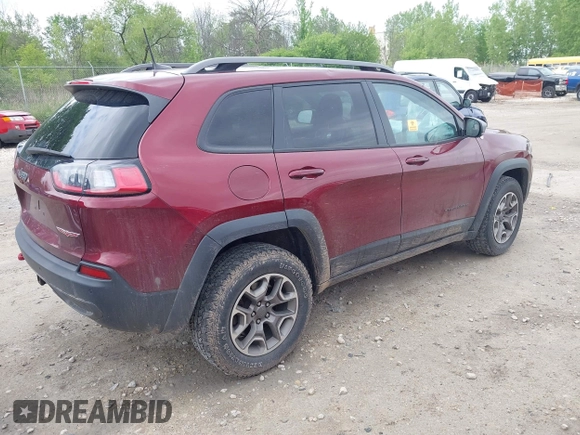 2020 Jeep Cherokee Trailhawk z VIN 1C4PJMBX8LD619813, wystawiony jako IAAI lot #42366066 z przebiegiem 69 811 mil mil oraz . Historia ofert i sprzedaży dostępna na DreamBid. Obrazek 4.