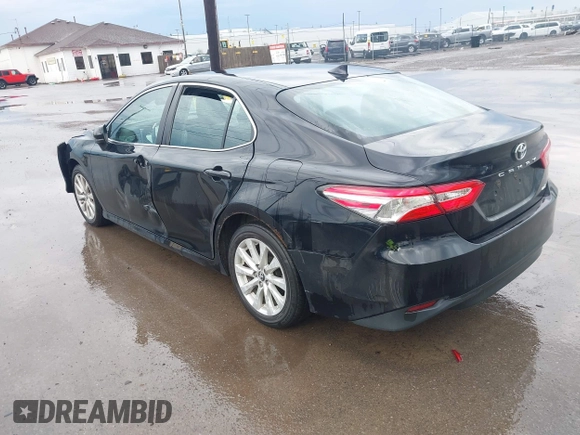 2019 Toyota Camry LE with VIN 4T1B11HK2KU263910, listed as a IAAI auction lot 42060008 with 31,433 mi miles and . Bid and sale history available at DreamBid. Image 3.