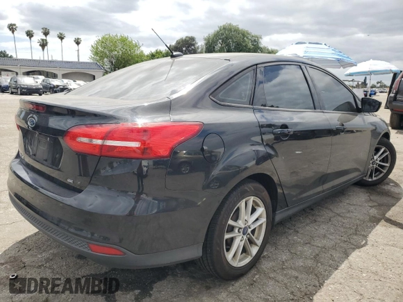 2015 Ford Focus SE with VIN 1FADP3F20FL249872, listed as a Copart auction lot 53506885 with 97,078 mi miles and Salvage title. Bid and sale history available at DreamBid. Image 3.