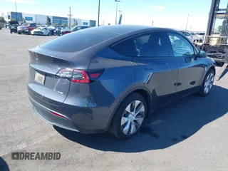 2023 Tesla Model Y Long Range with VIN 7SAYGAEE8PF976969, listed as a IAAI auction lot 41877784 with 25,896 mi miles. Bid and sale history available at carsss.com. Image 4.