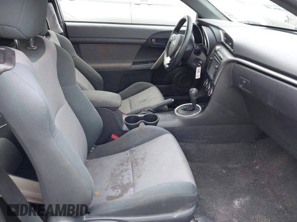 2014 Scion tC with VIN JTKJF5C74E3069104, listed as a IAAI auction lot 41579797 with 130,668 mi miles. Bid and sale history available at carsss.com. Image 5.