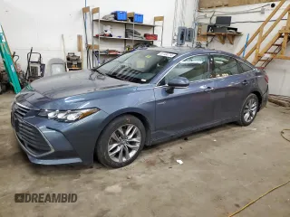 2020 Toyota Avalon Hybrid XLE z VIN 4T1A21FBXLU013795, wystawiony jako Copart lot #87104714 z przebiegiem 183 793 mil mil oraz Nie do naprawy • Non repairable. Historia ofert i sprzedaży dostępna na DreamBid. Obrazek 1.