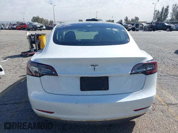 2023 Tesla Model 3 with VIN 5YJ3E1EA8PF398110, listed as a IAAI auction lot 41692006 with 112,699 mi miles and . Bid and sale history available at carsss.com. Image 16.