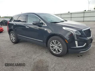 2023 Cadillac XT5 AWD Premium Luxury with VIN 1GYKNDRSXPZ145763, listed as a Copart auction lot 58387365 with 51,368 mi miles and Salvage title. Bid and sale history available at DreamBid. Image 4.