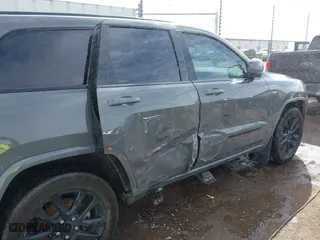 2021 Jeep Grand Cherokee Laredo X with VIN 1C4RJEAG5MC824738, listed as a IAAI auction lot 41580995 with 57,923 mi miles. Bid and sale history available at carsss.com. Image 6.