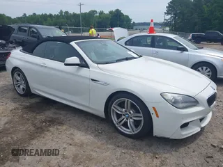 2014 BMW 6 Series 640i z VIN WBALW7C57EDX58765, wystawiony jako IAAI lot #42290109 z przebiegiem 65 041 mil mil oraz . Historia ofert i sprzedaży dostępna na DreamBid. Obrazek 1.
