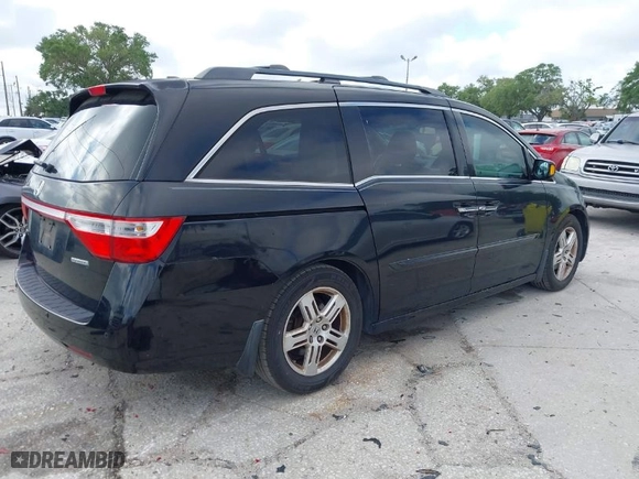 2013 Honda Odyssey Touring with VIN 5FNRL5H92DB003200, listed as a IAAI auction lot 41920237 with 167,483 mi miles. Bid and sale history available at carsss.com. Image 4.