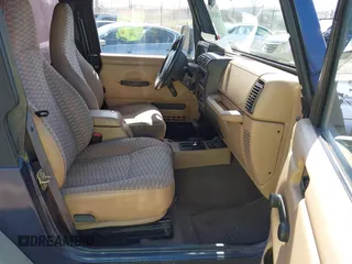 2000 Jeep Wrangler Sport with VIN 1J4FA49S7YP736479, listed as a IAAI auction lot 42042493 with 271,220 mi miles. Bid and sale history available at carsss.com. Image 5.