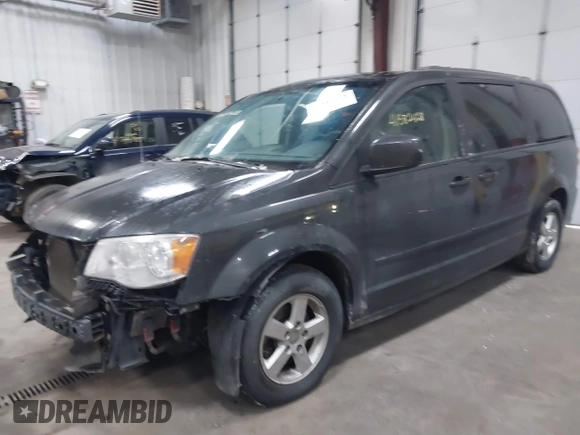 2012 Dodge Grand Caravan SXT with VIN 2C4RDGCG7CR358266, listed as a IAAI auction lot 41582428 with 169,137 mi miles and . Bid and sale history available at DreamBid. Image 17.