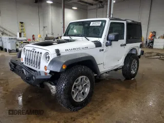2013 Jeep Wrangler Rubicon 10th Anniversary z VIN 1C4BJWCGXDL543958, wystawiony jako Copart lot #58492255 z przebiegiem 94 455 mil mil oraz Szkoda całkowita • Salvage title. Historia ofert i sprzedaży dostępna na DreamBid. Obrazek 1.